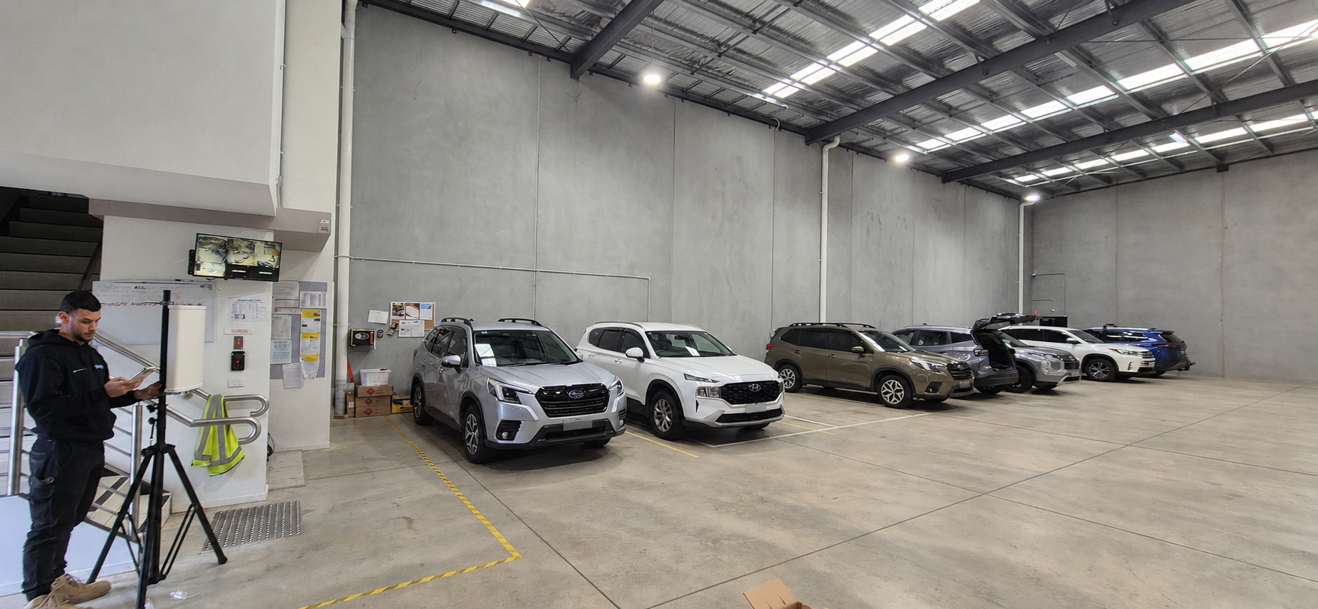 fleet vehicles parked at depot at evening