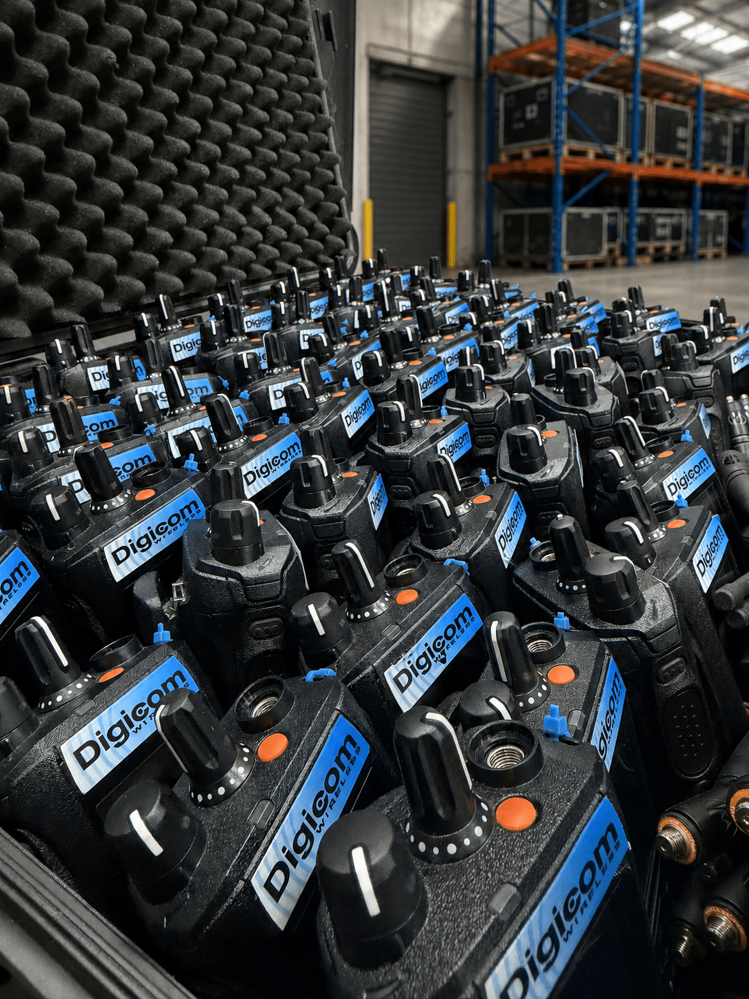 Worker using a hired Motorola two-way radio on a warehouse site